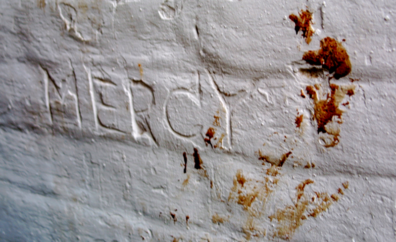 Image of writing carved into the exercise yard at Athens via Justin Masterson/Flickr